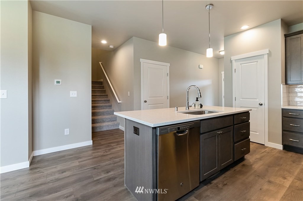6934 Red Ridge Drive, Unit B Lynden, WA 98264 - Photo 10 of 34 a kitchen with a sink and wooden floor