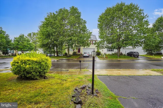 a kitchen with stainless steel appliances granite countertop a refrigerator a stove and a sink