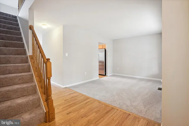 a kitchen with stainless steel appliances granite countertop wooden cabinets a stove top oven a sink and dishwasher