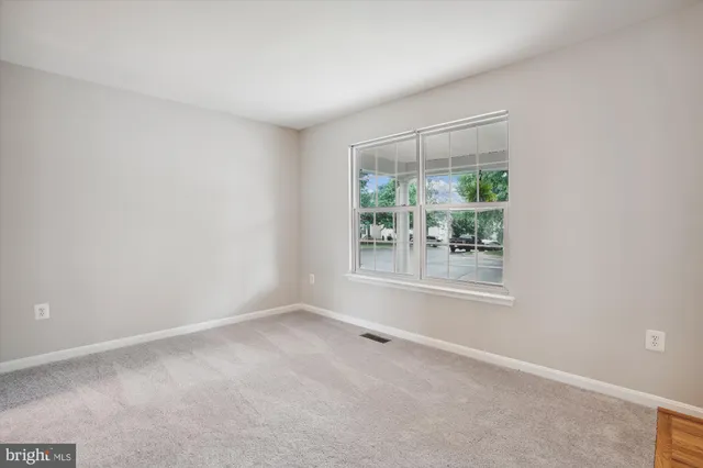 a kitchen with sink a stove and a microwave