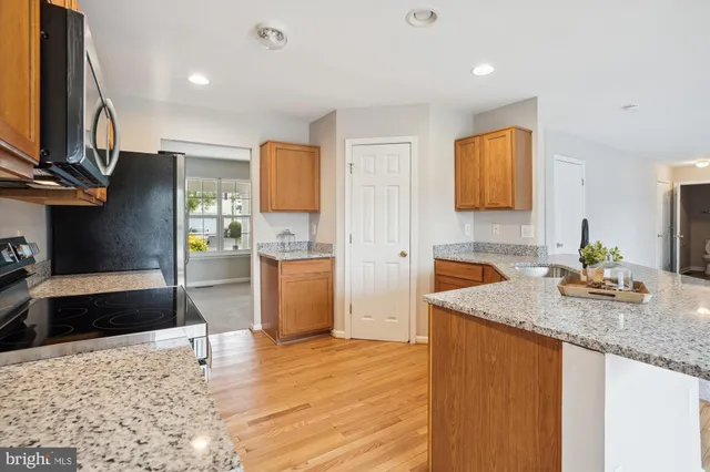 a view of empty room with a fireplace and fan