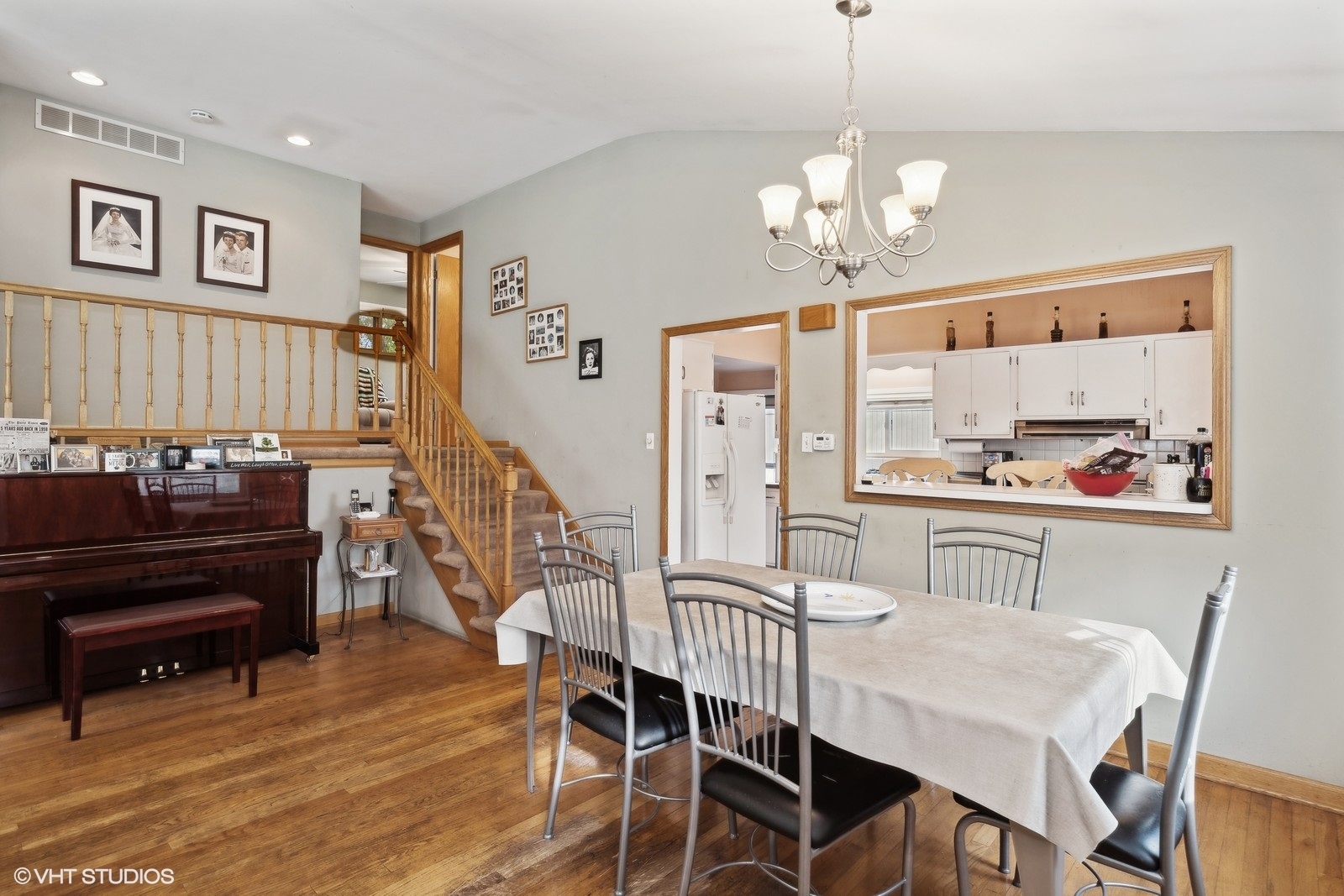 1425 Sunset Ridge Road Northbrook, IL 60062 - Photo 7 of 17 a view of a dining room with furniture a chandelier and wooden floor