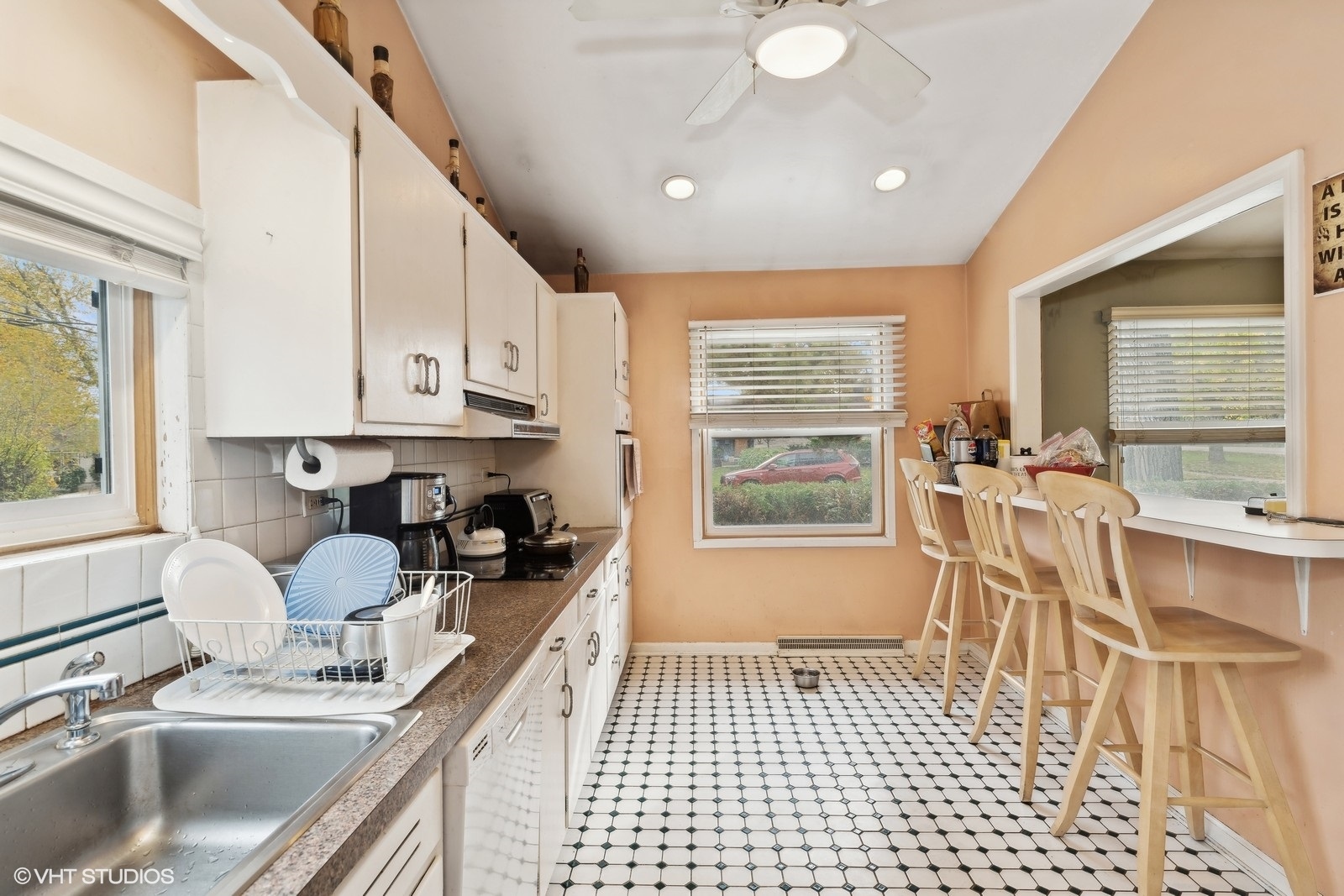1425 Sunset Ridge Road Northbrook, IL 60062 - Photo 9 of 17 a kitchen with a sink a window and cabinets