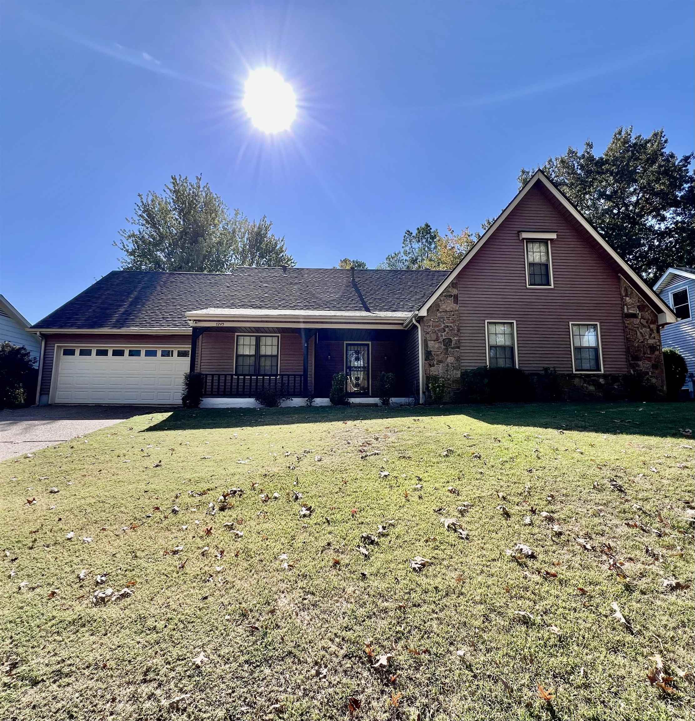 7245 Barnstable Road Memphis, TN 38125 - Photo 1 of 36 Front facade featuring a front lawn and a garage