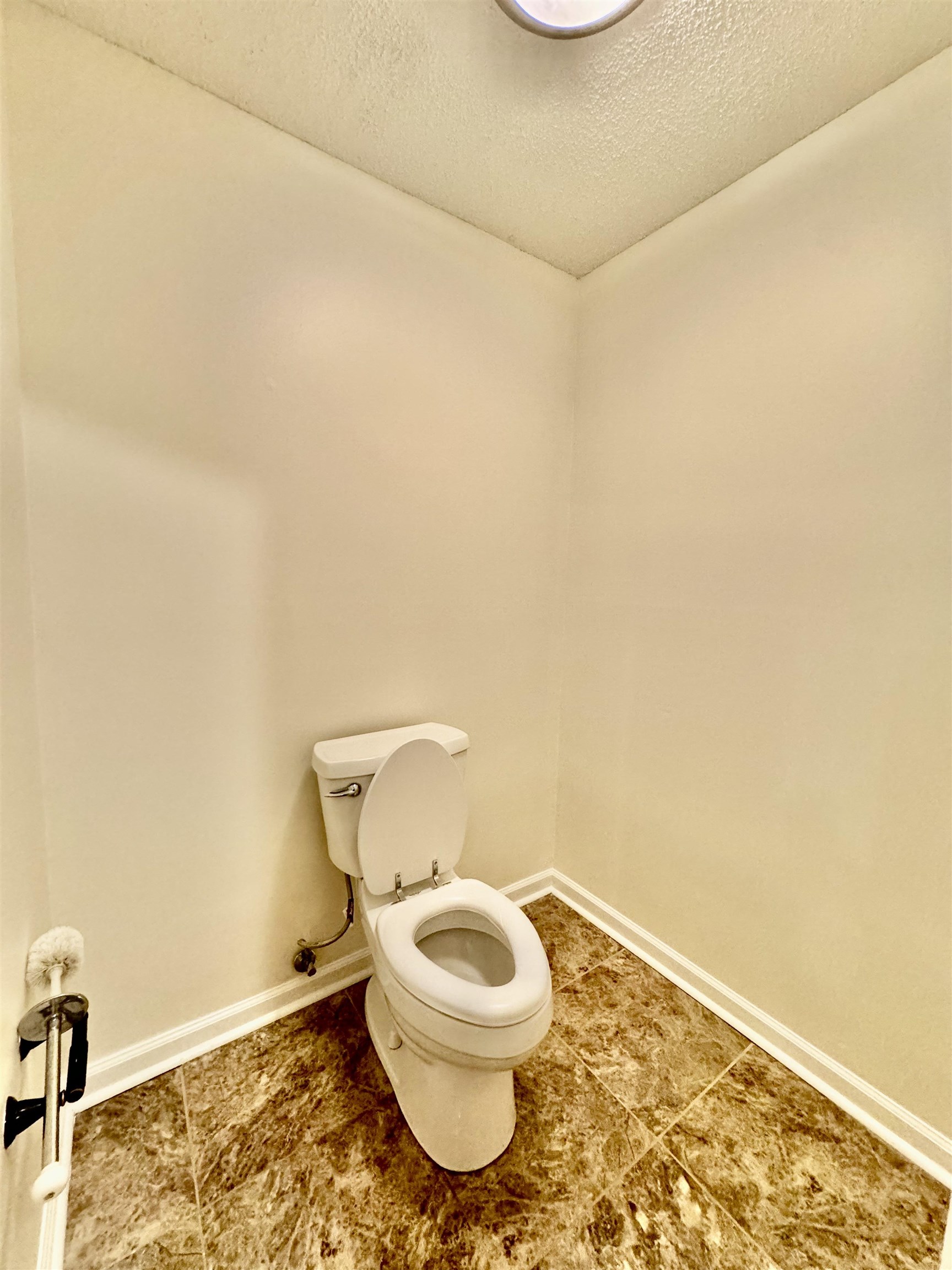 7245 Barnstable Road Memphis, TN 38125 - Photo 20 of 36 Bathroom with a textured ceiling, tile patterned floors, and toilet