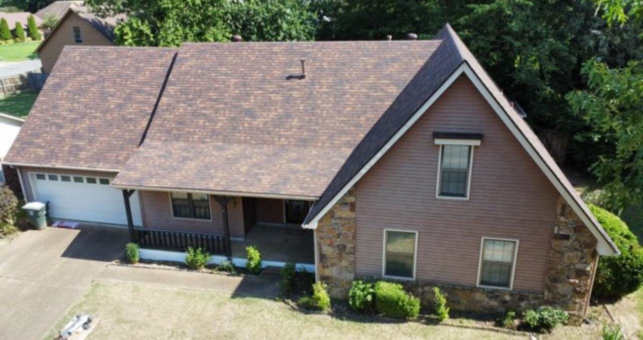 7245 Barnstable Road Memphis, TN 38125 - Photo 2 of 36 View of front facade with a garage and covered porch