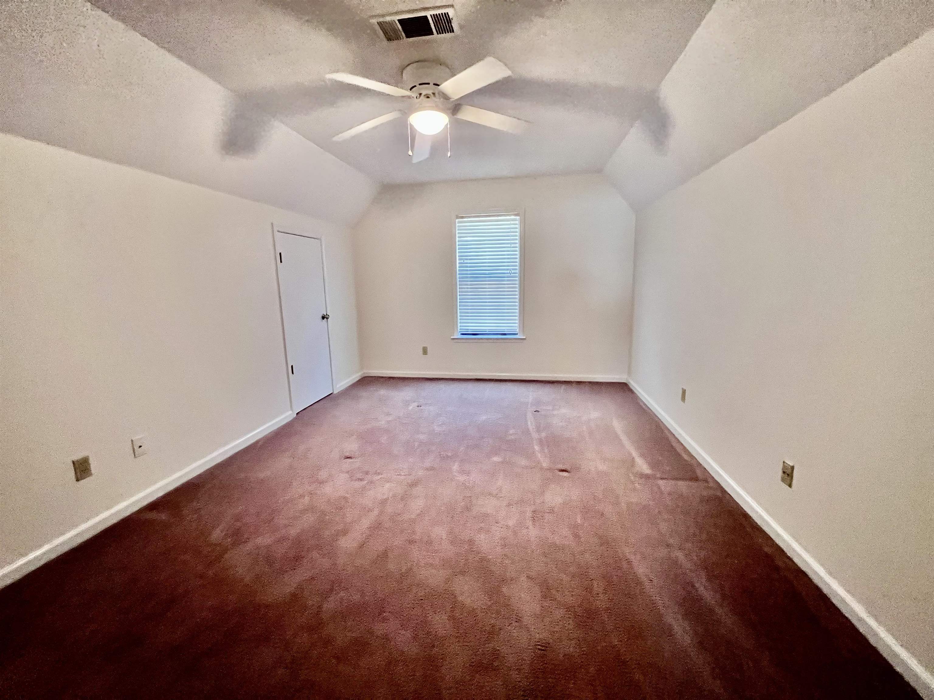 7245 Barnstable Road Memphis, TN 38125 - Photo 26 of 36 Bonus room with ceiling fan, a textured ceiling, lofted ceiling, and carpet floors