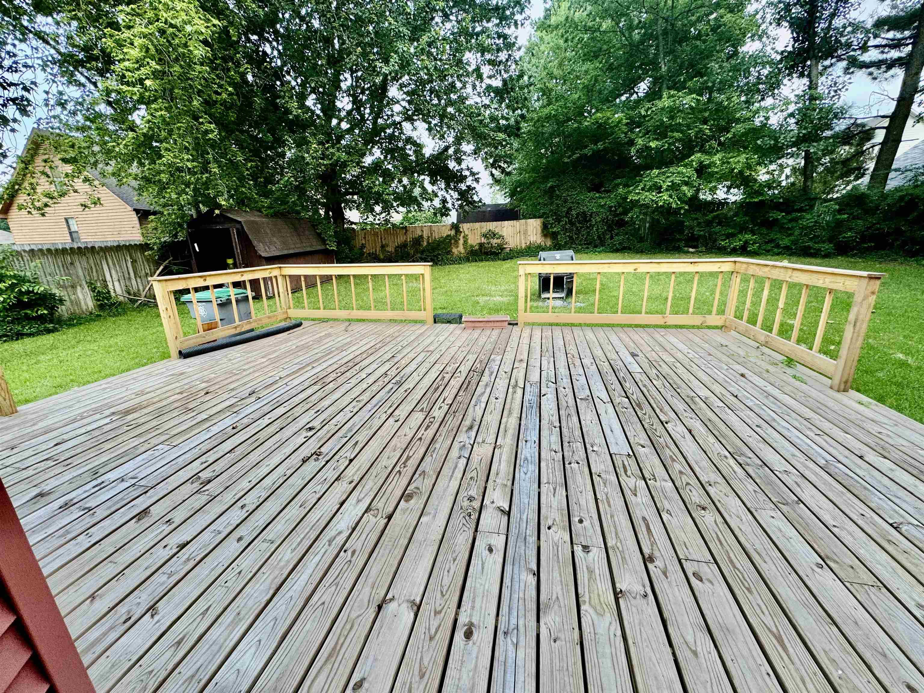 7245 Barnstable Road Memphis, TN 38125 - Photo 36 of 36 Deck with a shed and a yard