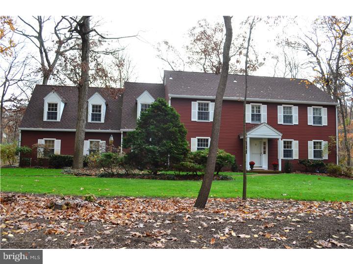3 Kendles Run Road Moorestown, NJ 08057 - Photo 2 of 19 a front view of a house with a garden and trees