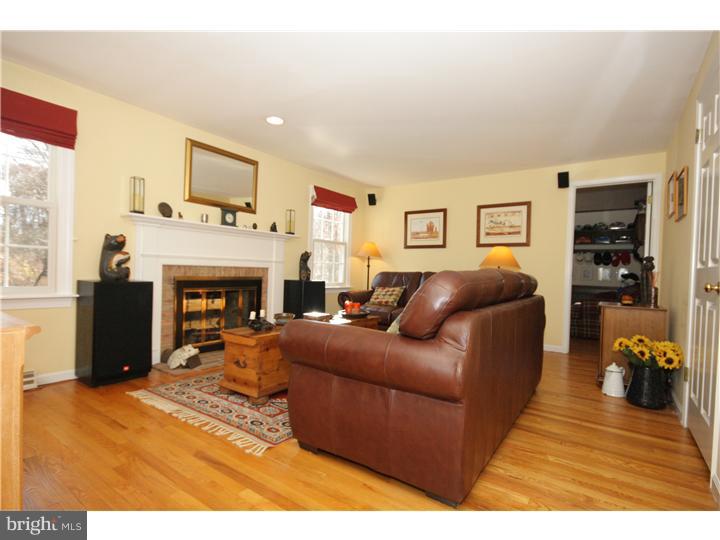 3 Kendles Run Road Moorestown, NJ 08057 - Photo 5 of 19 a living room with furniture a fireplace and a large window