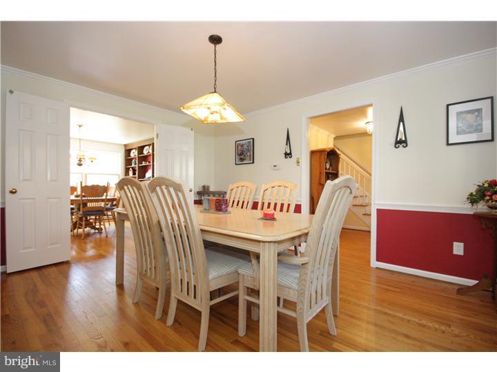 3 Kendles Run Road Moorestown, NJ 08057 - Photo 8 of 19 a dining room with furniture a chandelier and wooden floor