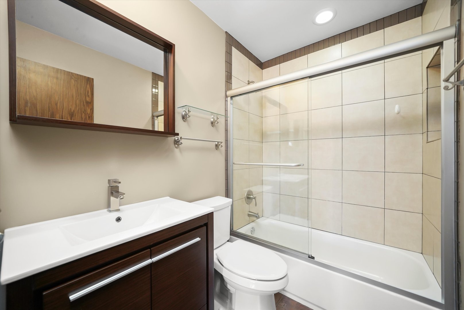 1400 North Elmhurst Road, Unit 302 Mount Prospect, IL 60056 - Photo 12 of 18 a bathroom with a sink a toilet and shower