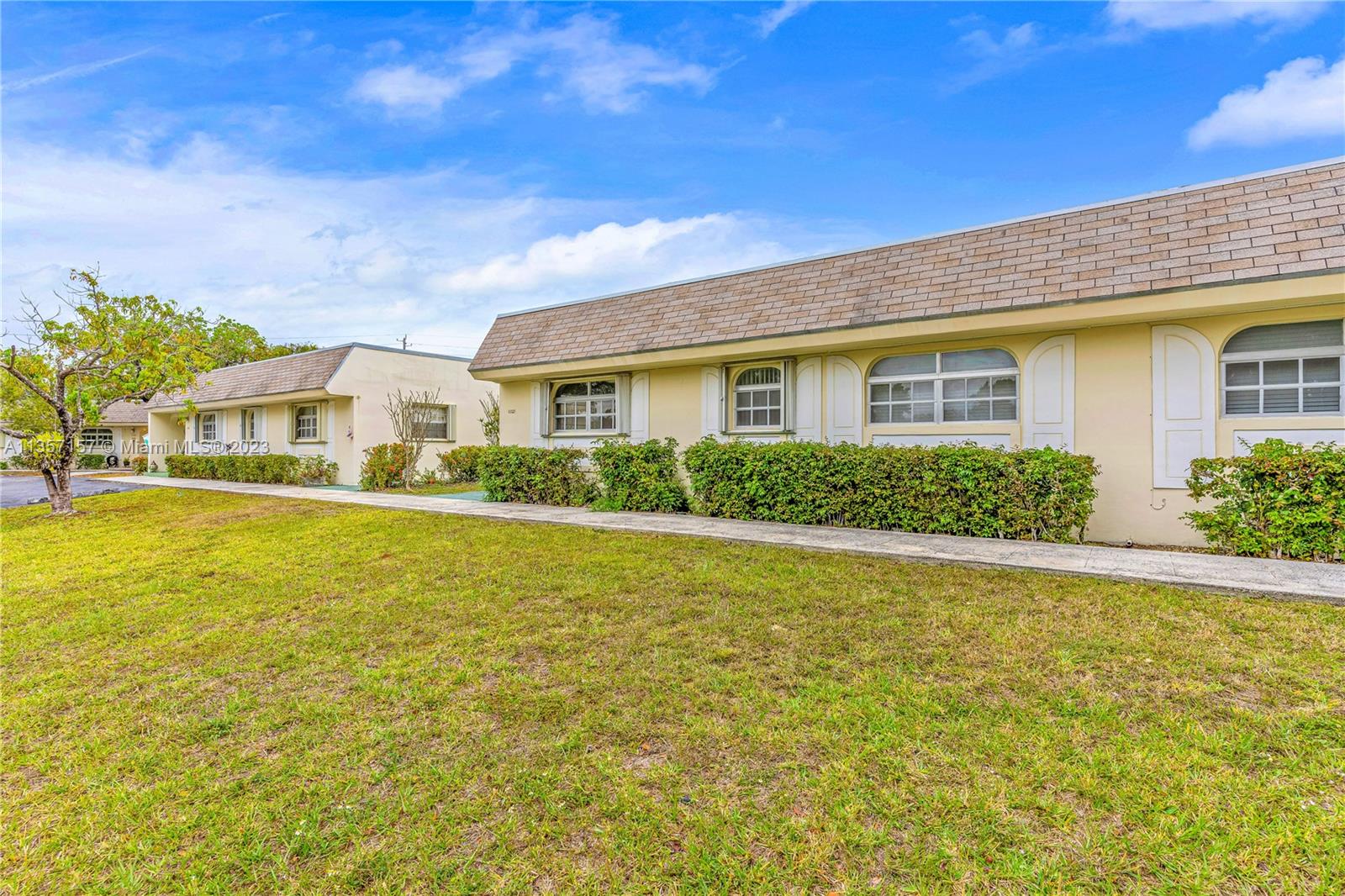 a front view of a house with swimming pool