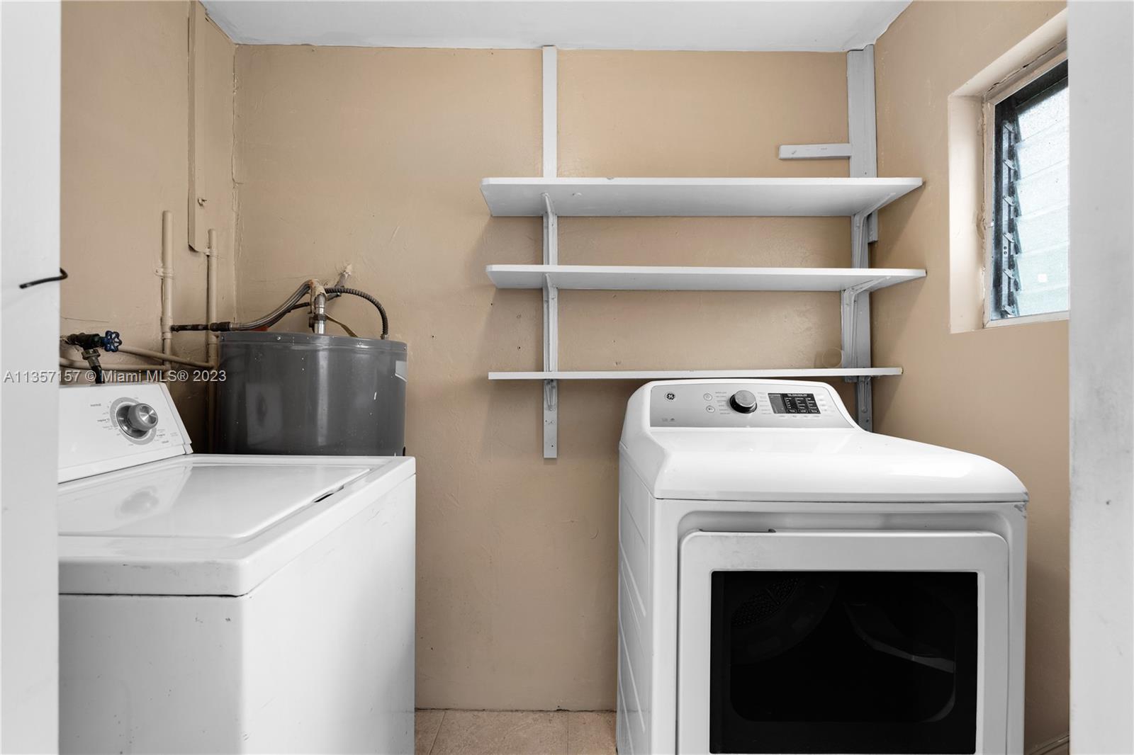 West Perrine Miami, FL 33157 - Photo 18 of 23 a utility room with dryer and washer