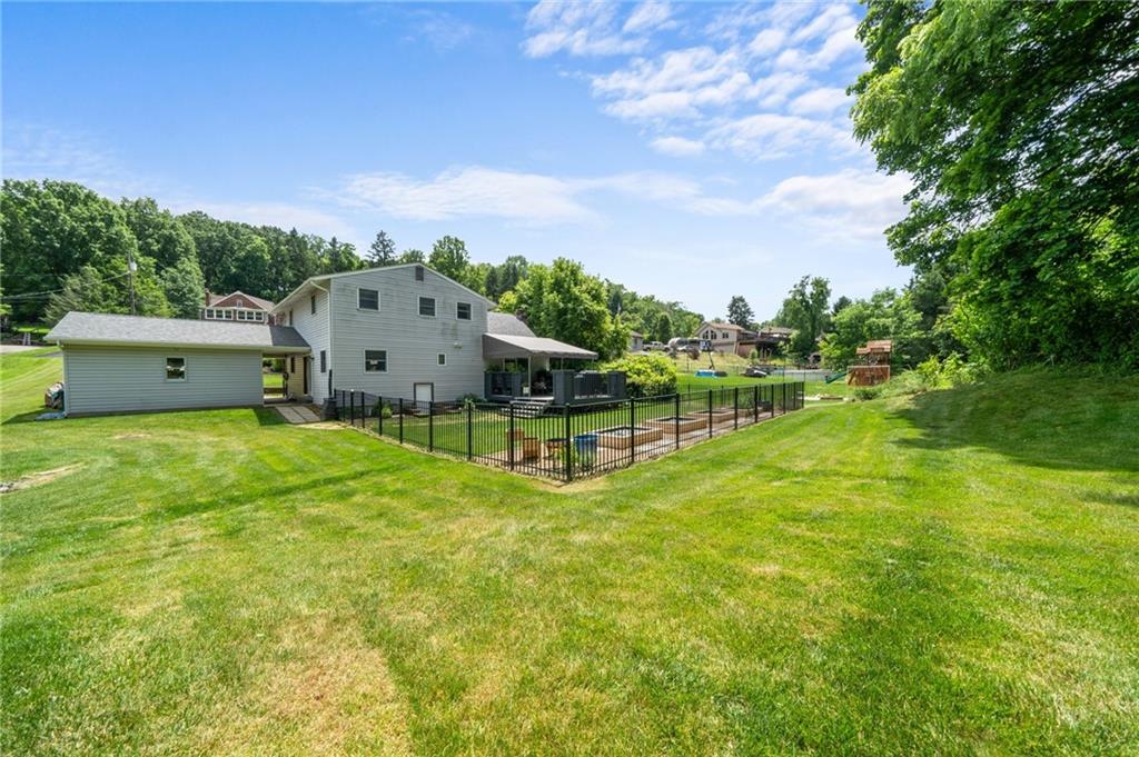 230 McWilliams Road Trafford, PA 15085 - Photo 49 of 50 View of house from back property line. Garage is oversized with tons of storage + loft area for storage as well!