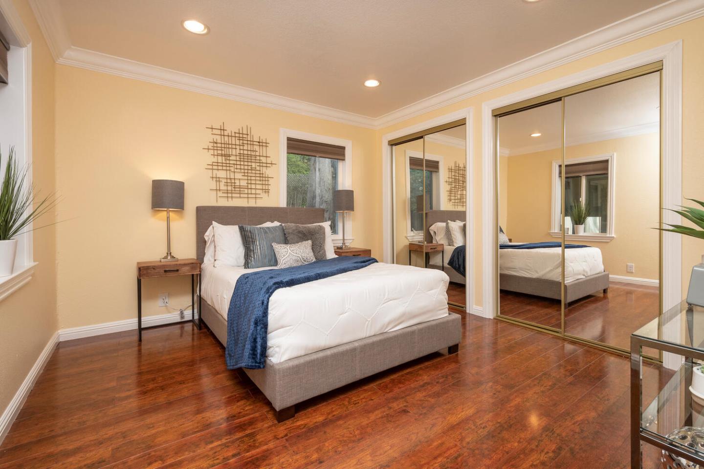 301 Channing Way Pacifica, CA 94044 - Photo 11 of 35 a bedroom with a bed and a large window