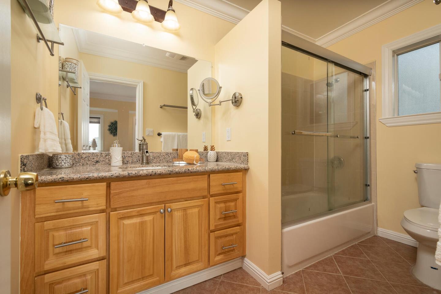 301 Channing Way Pacifica, CA 94044 - Photo 18 of 35 a bathroom with a granite countertop sink a toilet and shower