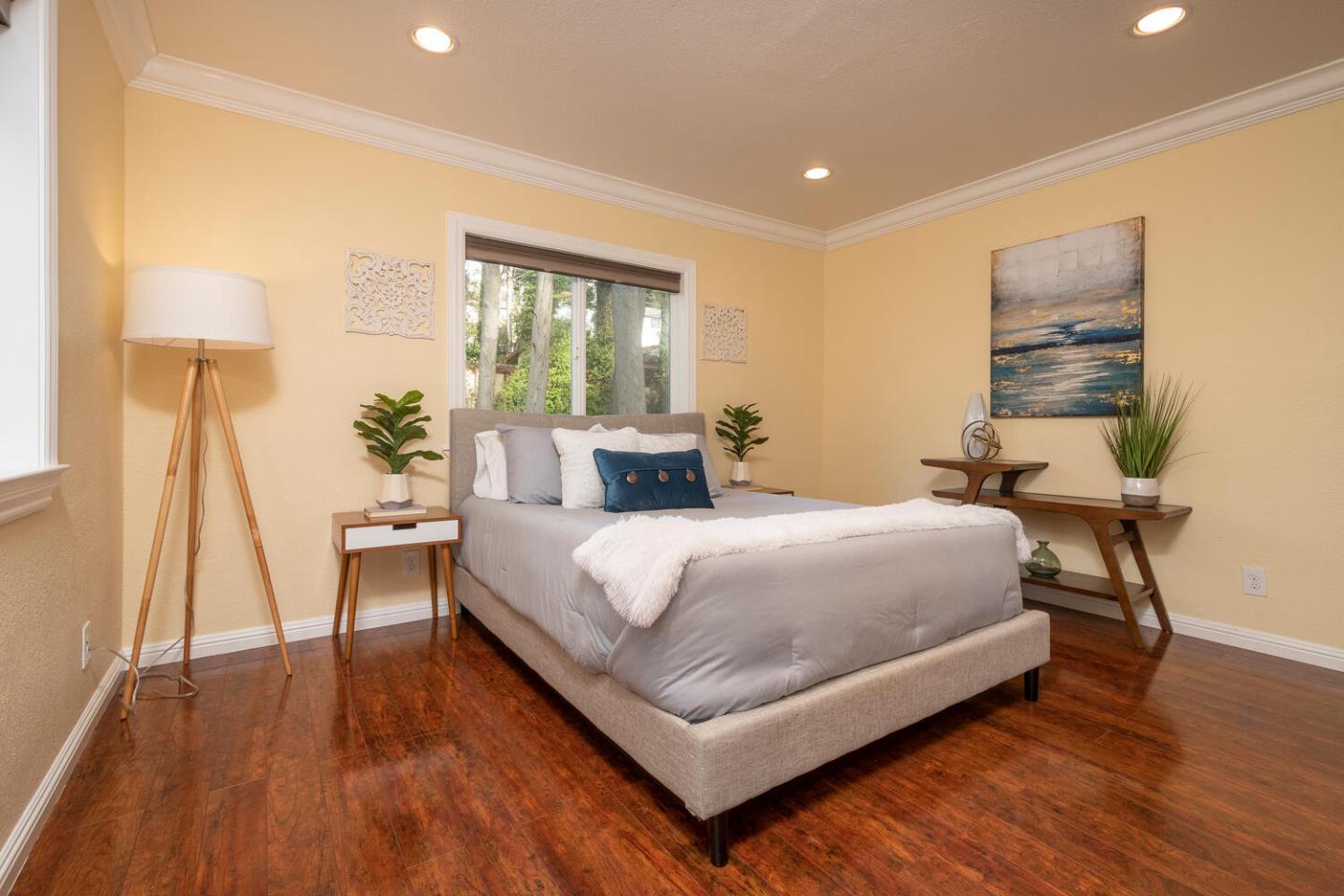 301 Channing Way Pacifica, CA 94044 - Photo 19 of 35 a bedroom with a bed and a table