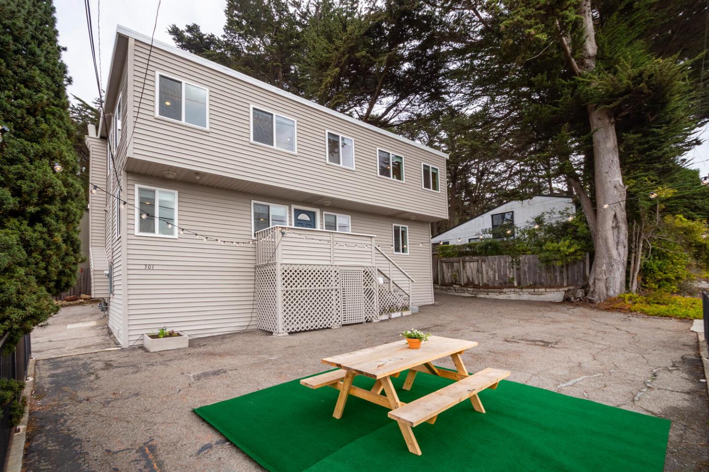 301 Channing Way Pacifica, CA 94044 - Photo 28 of 35 a front view of a house with a yard table and chairs