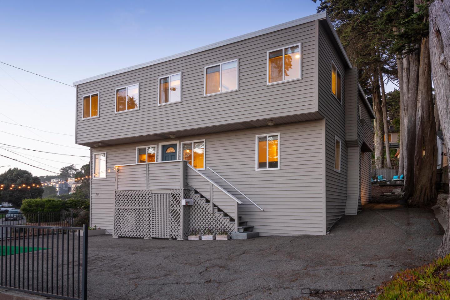 301 Channing Way Pacifica, CA 94044 - Photo 34 of 35 a view of a house with a small yard and a large tree