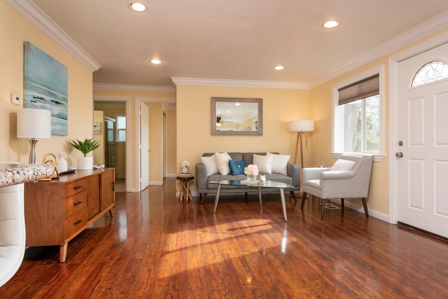 301 Channing Way Pacifica, CA 94044 - Photo 4 of 35 a living room with furniture a wooden floor and next to a window