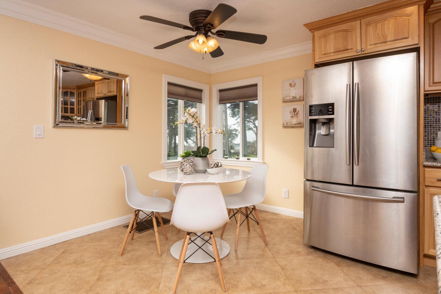 301 Channing Way Pacifica, CA 94044 - Photo 6 of 35 a kitchen with stainless steel appliances a refrigerator and a dining table