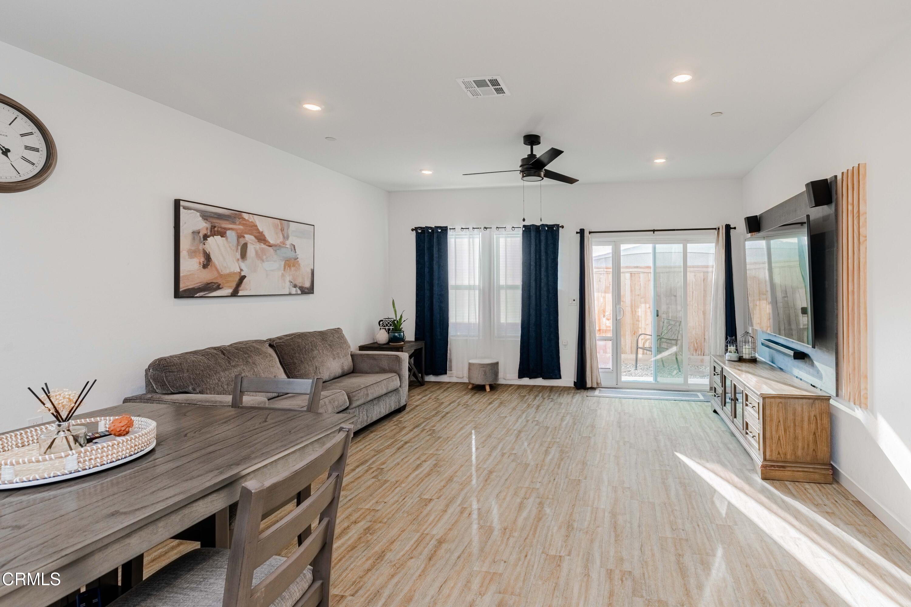 3305 Lilac View Shafter, CA 93263 - Photo 15 of 36 a living room with furniture and a flat screen tv