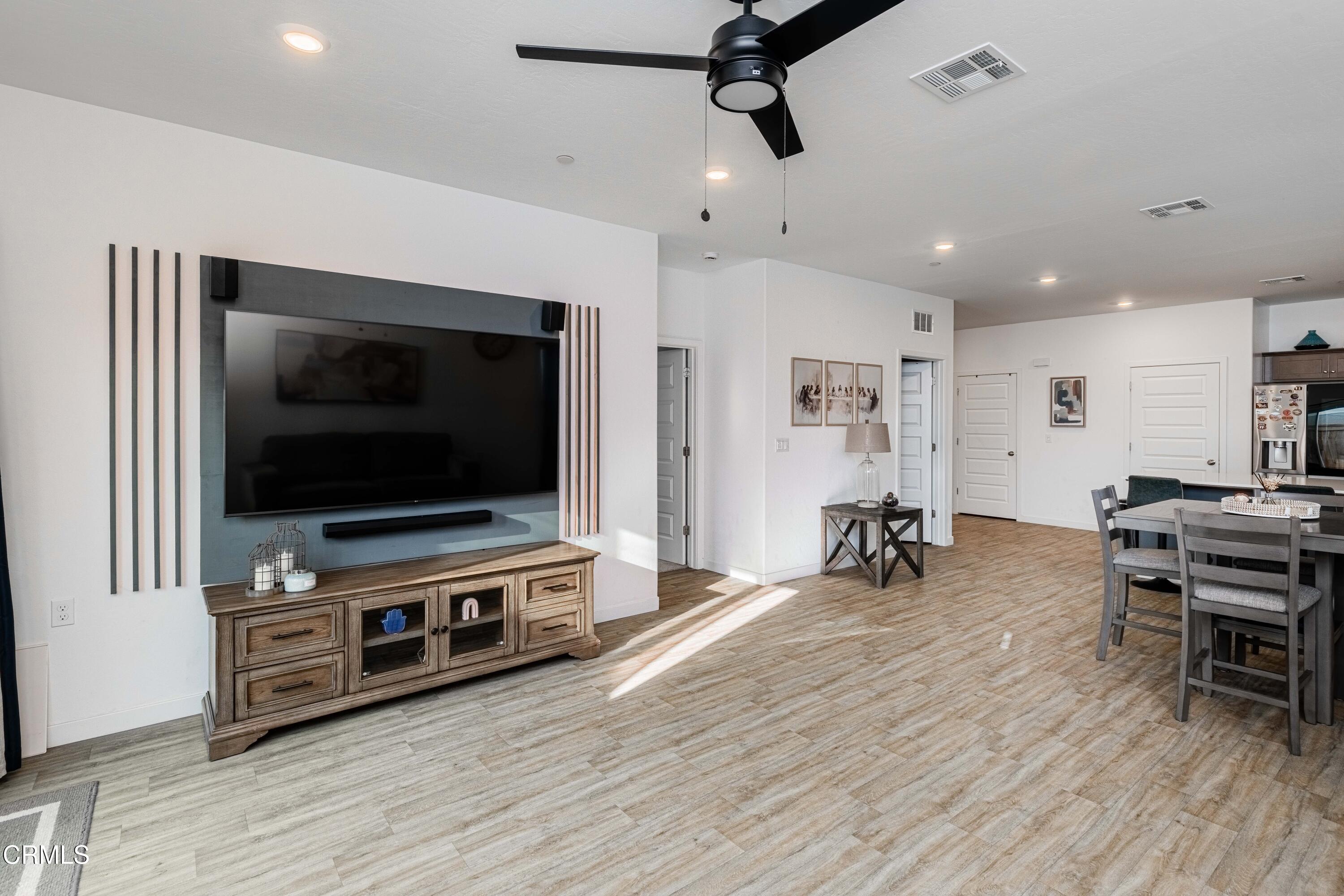 3305 Lilac View Shafter, CA 93263 - Photo 17 of 36 a living room with furniture and a flat screen tv