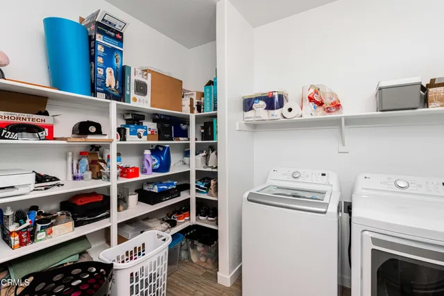 a room with a wooden floor and shelf