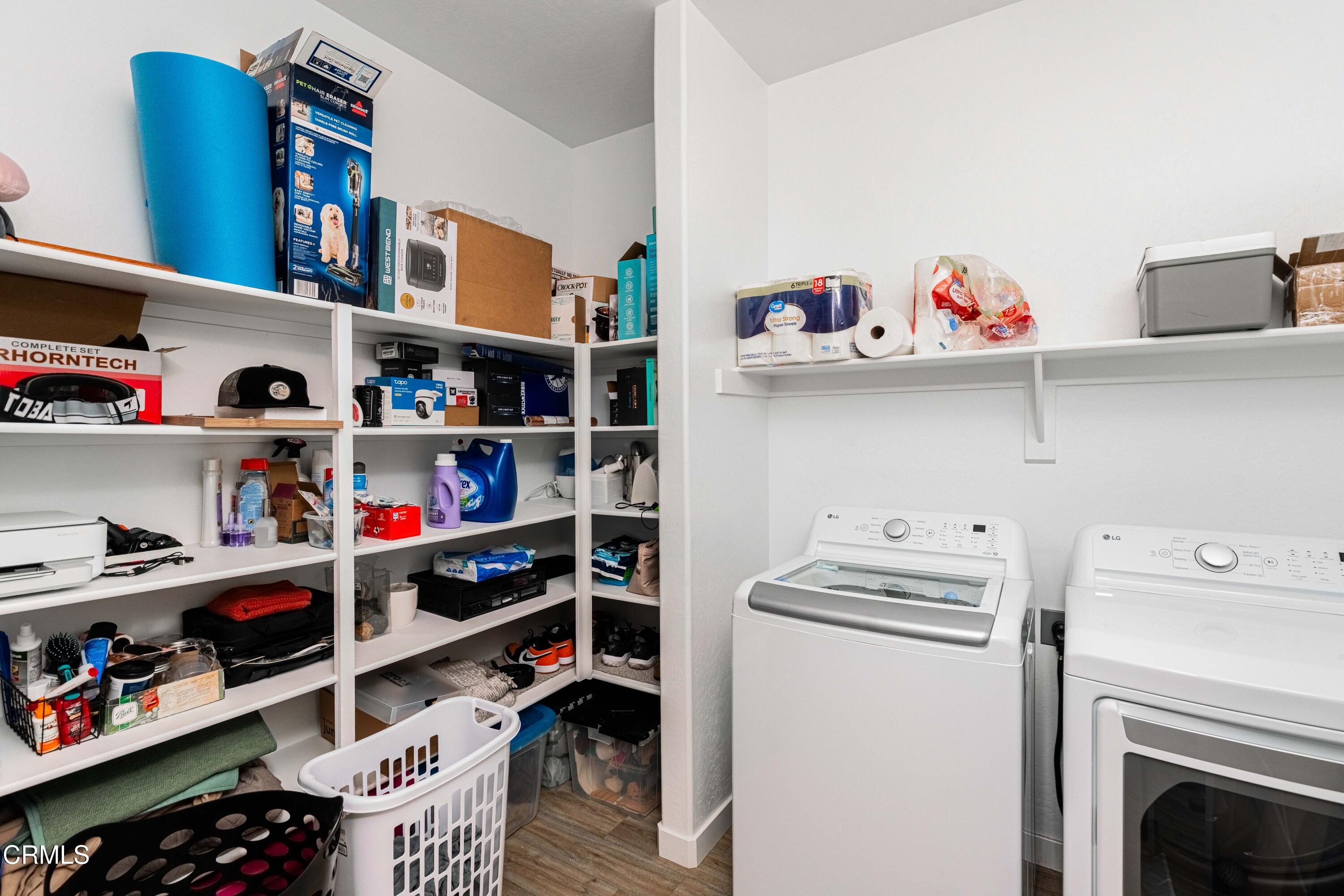 3305 Lilac View Shafter, CA 93263 - Photo 21 of 36 a room with a wooden floor and shelf