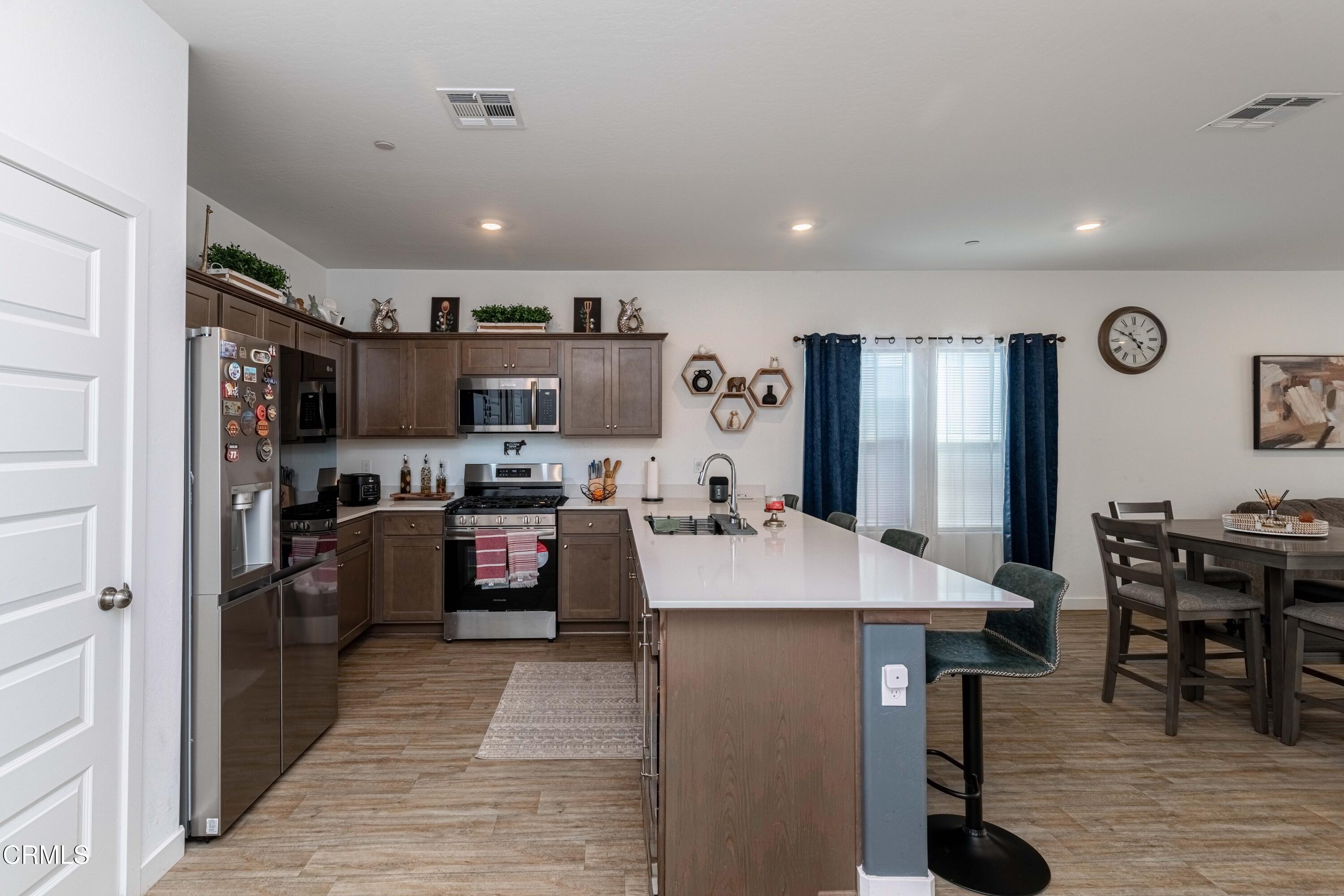 3305 Lilac View Shafter, CA 93263 - Photo 10 of 36 a large kitchen with lots of counter space a sink appliances and cabinets