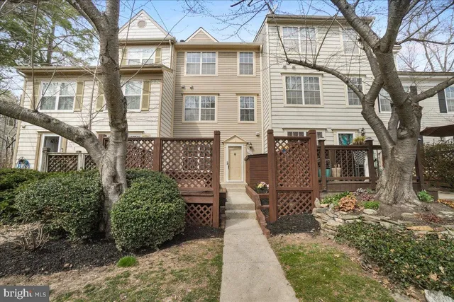 a front view of a house with sitting area