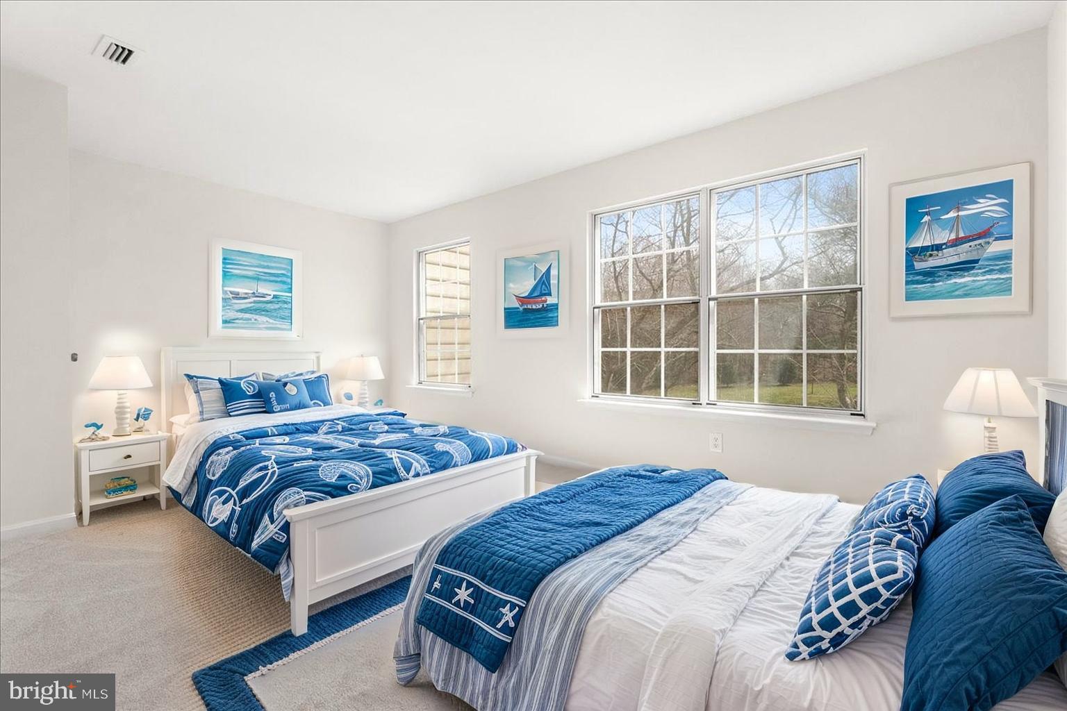 19742 Teakwood Circle, Unit 52 Germantown, MD 20874 - Photo 15 of 29 a bedroom with a bed and a large window