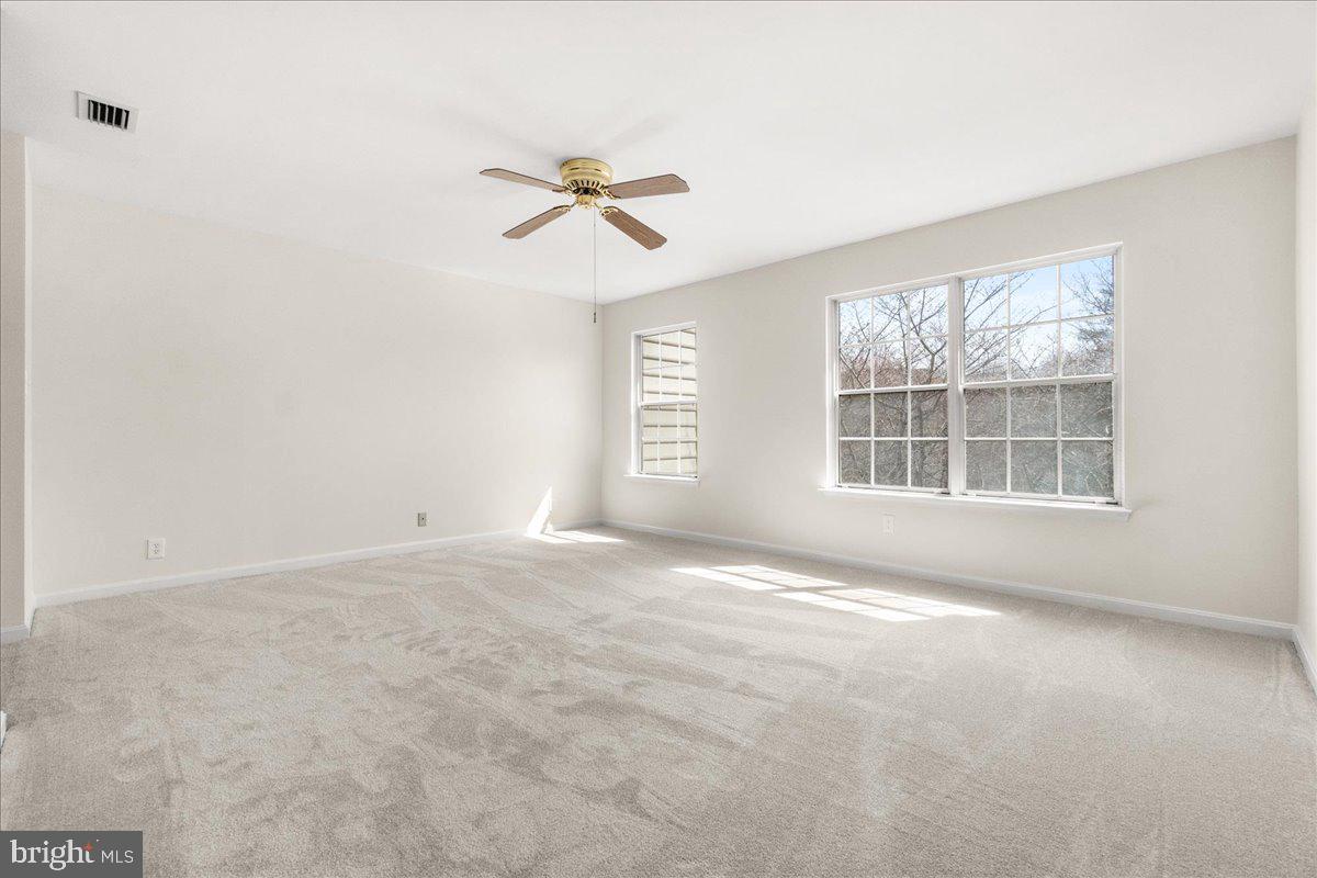 19742 Teakwood Circle, Unit 52 Germantown, MD 20874 - Photo 17 of 29 a view of an empty room with a window