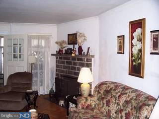 902 Marlyn Road Philadelphia, PA 19151 - Photo 2 of 6 a living room with furniture a flat screen tv and a lamp