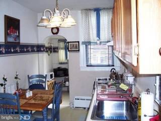 902 Marlyn Road Philadelphia, PA 19151 - Photo 4 of 6 a room with furniture a chandelier and a window