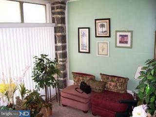 902 Marlyn Road Philadelphia, PA 19151 - Photo 5 of 6 a living room with furniture and a potted plant