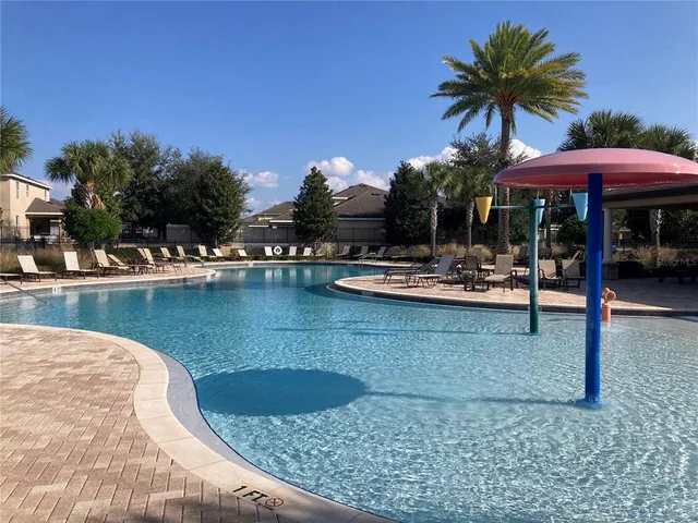 a view of a swimming pool with a patio