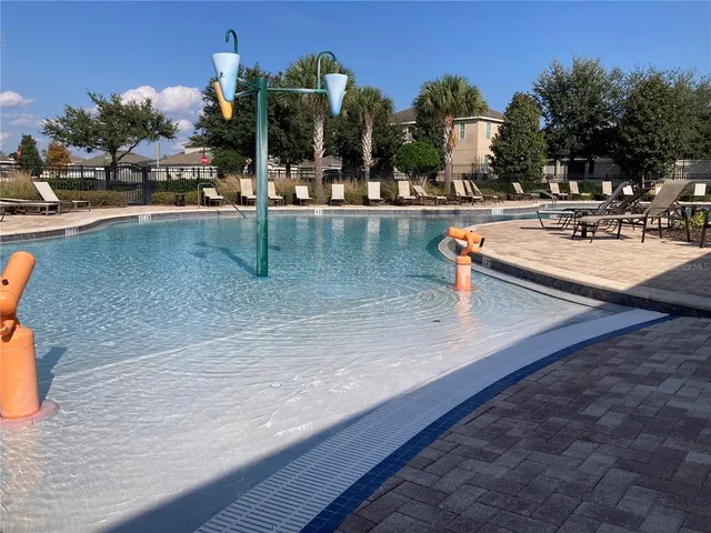 swimming pool view with outdoor seating