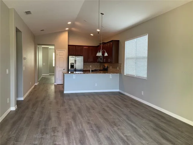 a view of a kitchen with a sink and a window