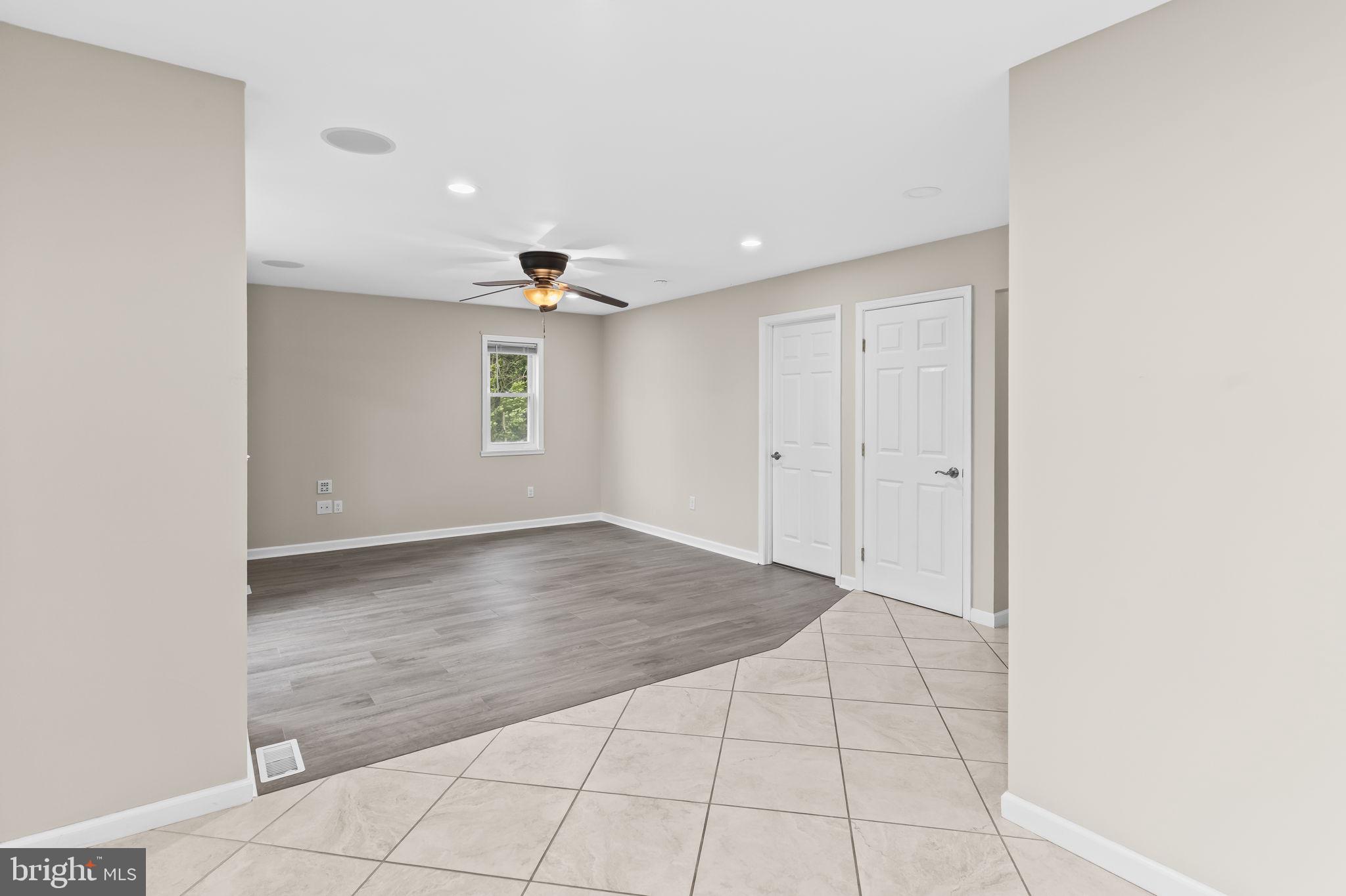 25001 Half Pone Point Road Hollywood, MD 20636 - Photo 12 of 40 an empty room with windows and closet