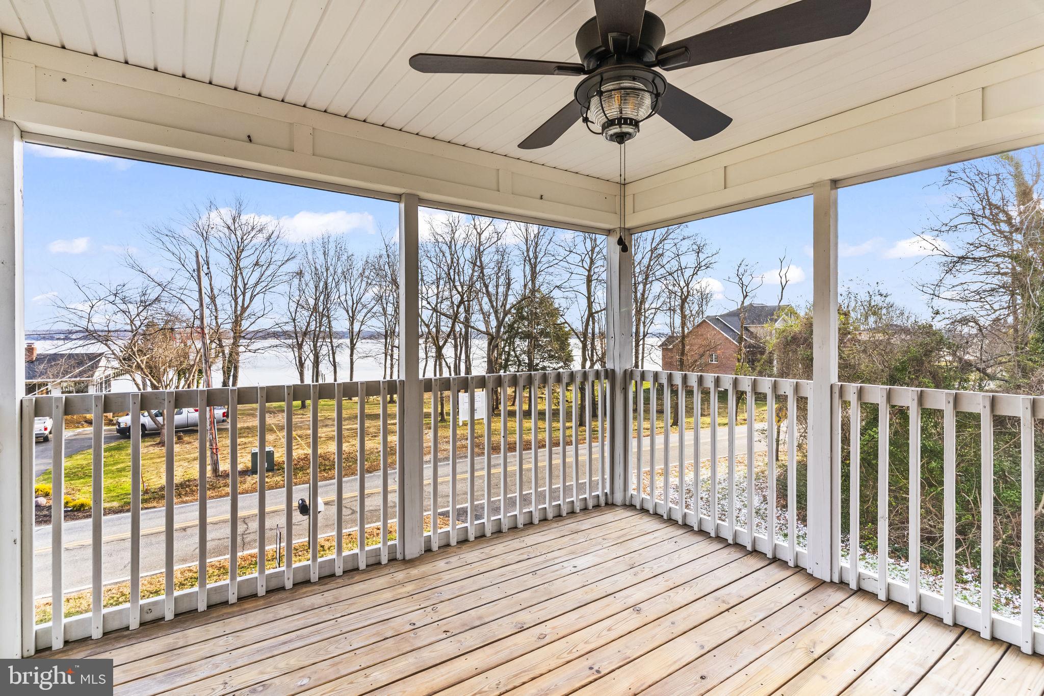 25001 Half Pone Point Road Hollywood, MD 20636 - Photo 2 of 40 a view of a room with wooden floor and iron stairs