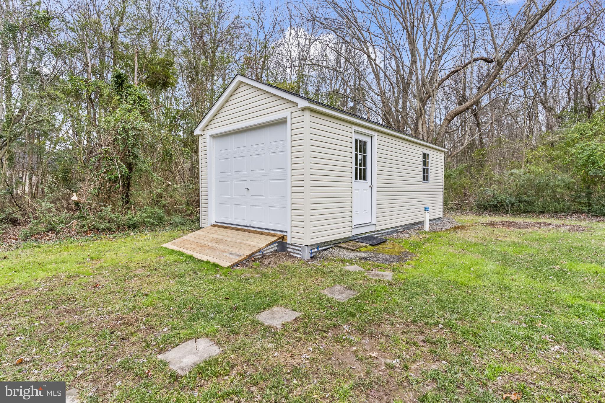 25001 Half Pone Point Road Hollywood, MD 20636 - Photo 32 of 40 a view of a backyard with a garden