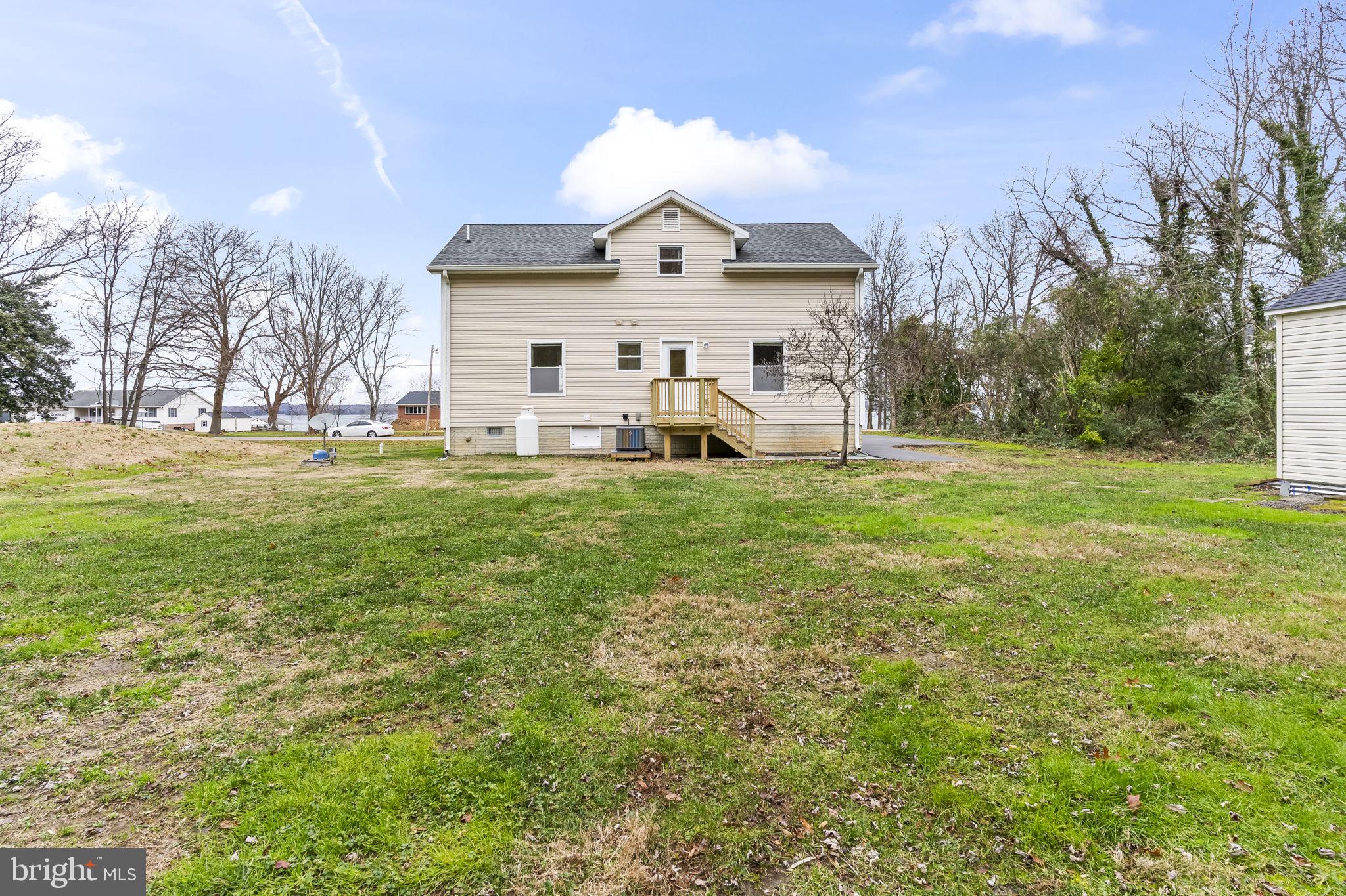 25001 Half Pone Point Road Hollywood, MD 20636 - Photo 35 of 40 a view of a house with a yard and a garden