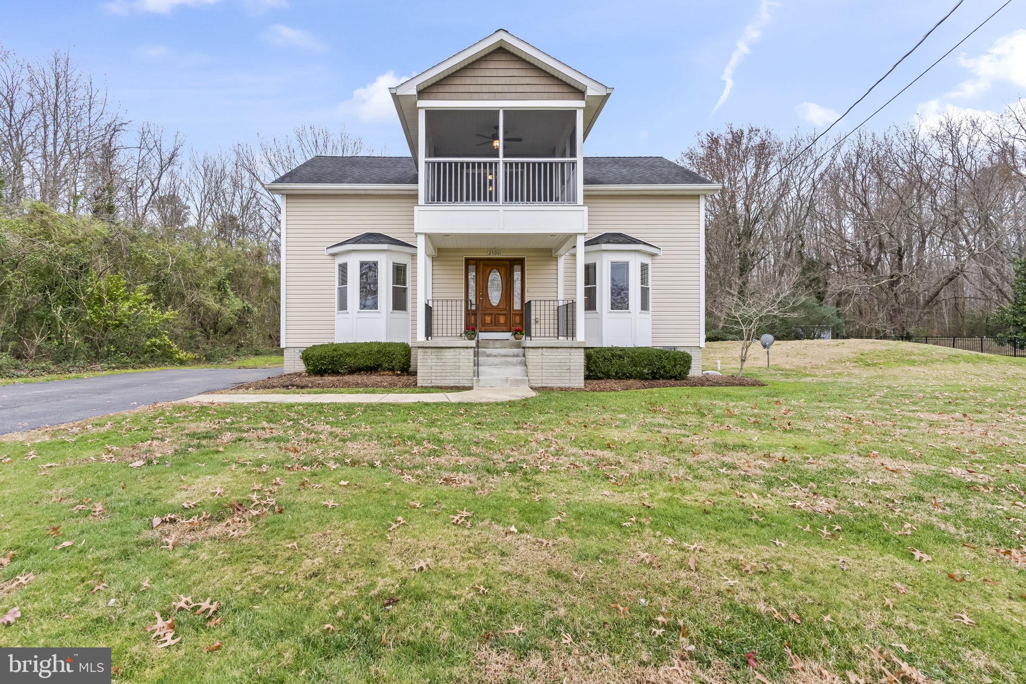25001 Half Pone Point Road Hollywood, MD 20636 - Photo 37 of 40 a front view of a house with a yard