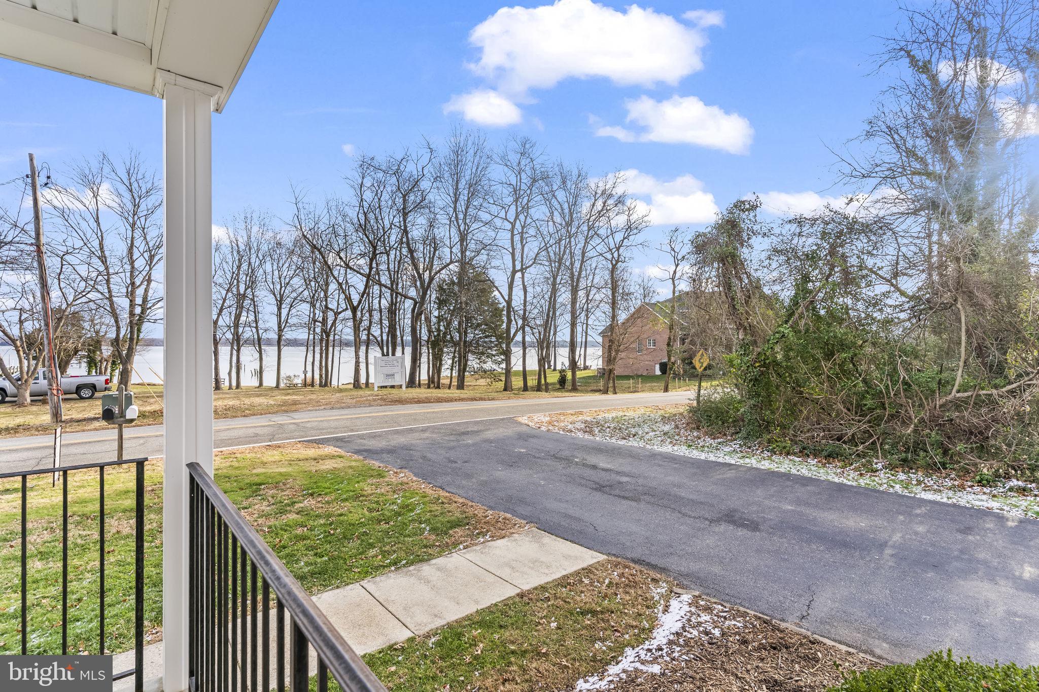 25001 Half Pone Point Road Hollywood, MD 20636 - Photo 39 of 40 a view of a backyard with snow on the road