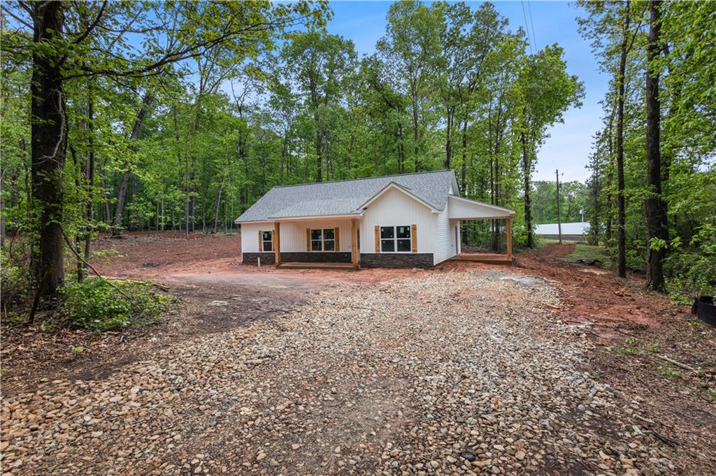 1765 Harmony Road Temple, GA 30179 - Photo 1 of 1 a front view of a house with garden
