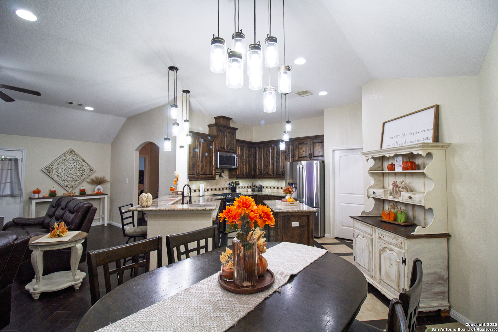 504 West Sullivan Street Skidmore, TX 78389 - Photo 11 of 35 a dining room filled with furniture and chandelier
