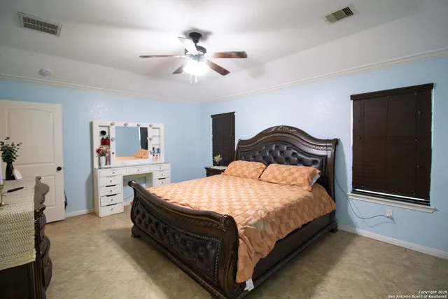 a bedroom with a bed and dresser