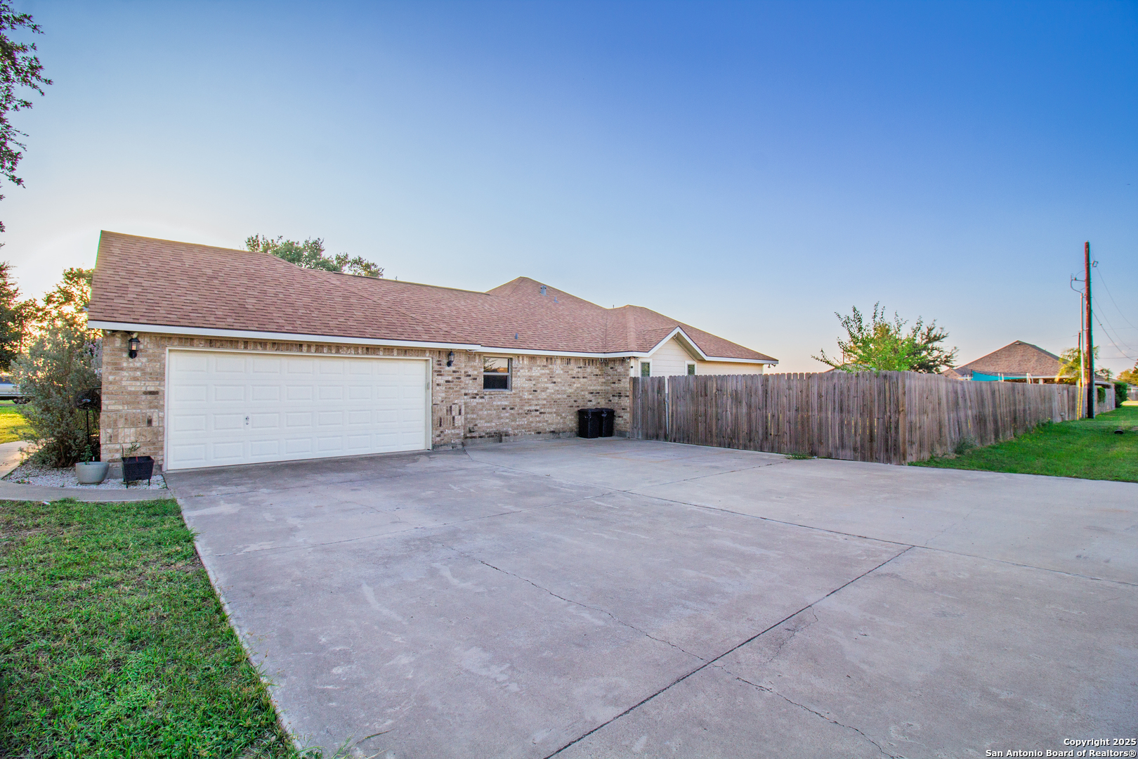 504 West Sullivan Street Skidmore, TX 78389 - Photo 31 of 35 a house with yard in front of it